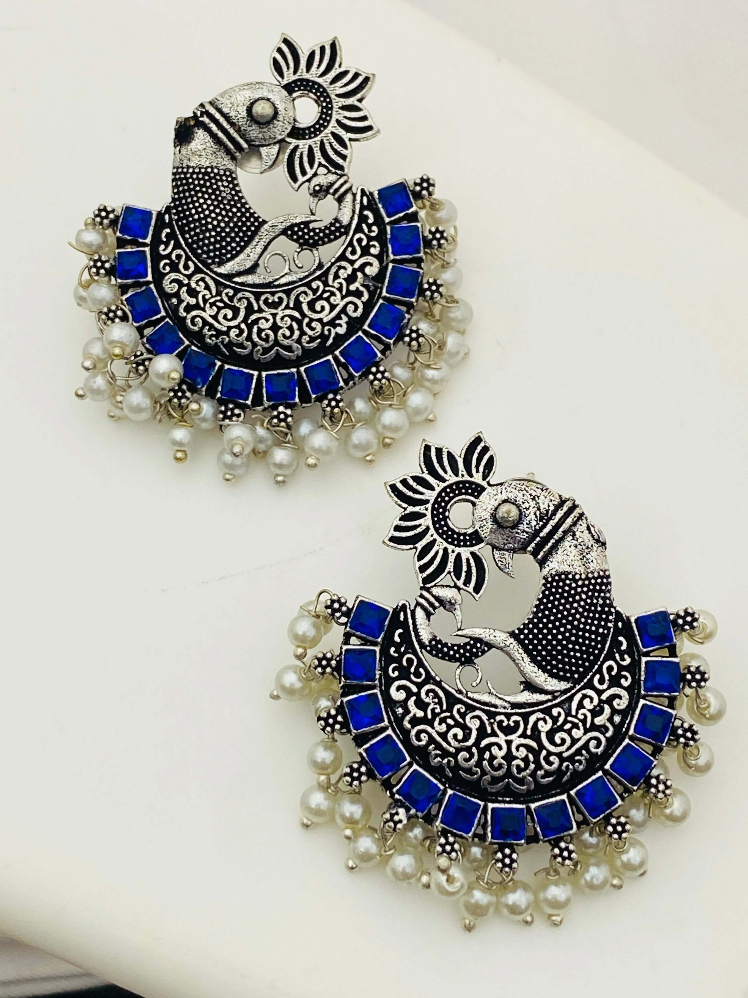 Pleasing Blue Color Stone Beaded Peacock Model Silver Toned Oxidized Earrings With Pearl Drops