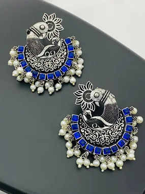 Pleasing Blue Color Stone Beaded Peacock Model Silver Toned Oxidized Earrings With Pearl Drops