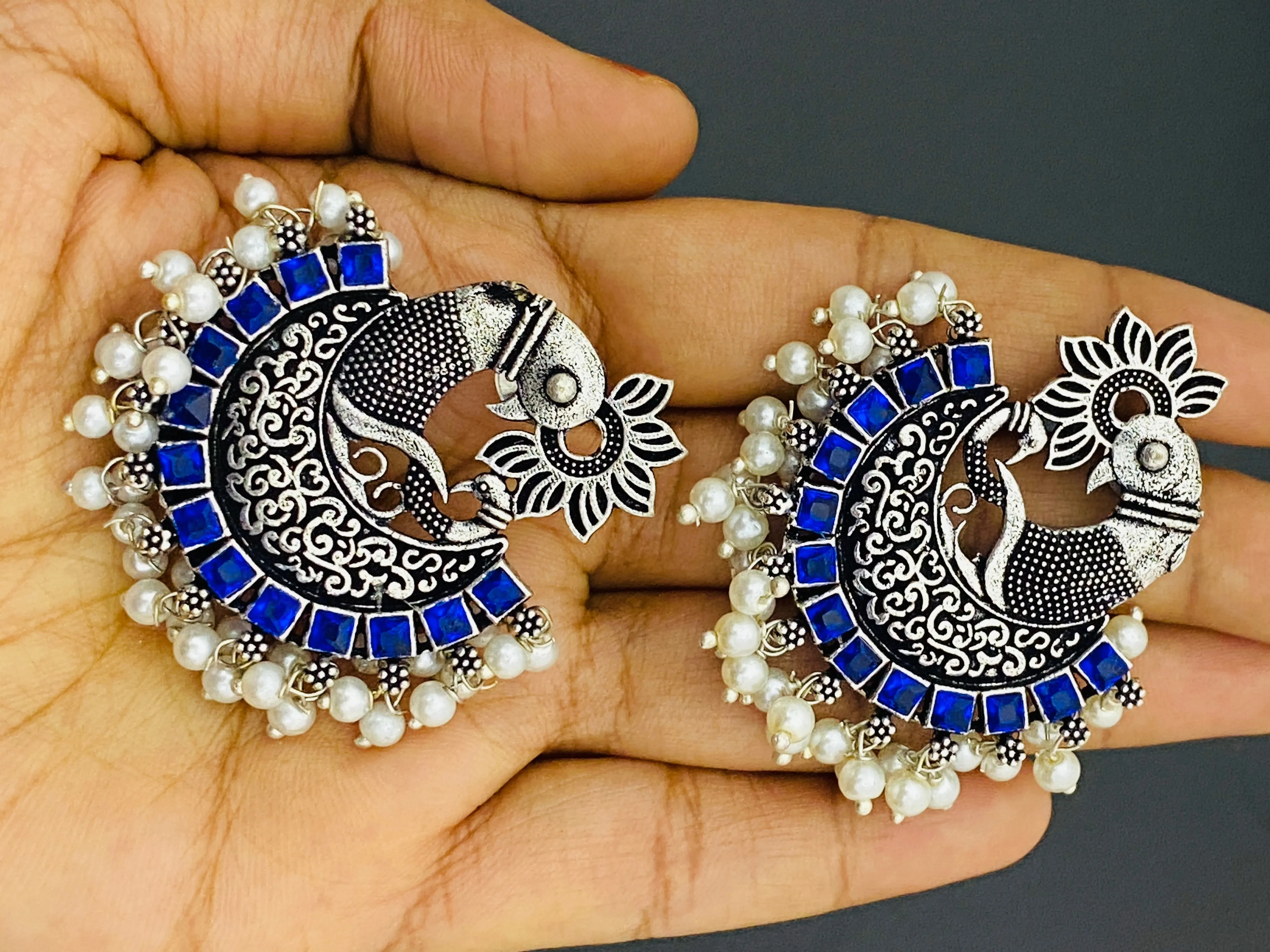 Pleasing Blue Color Stone Beaded Peacock Model Silver Toned Oxidized Earrings With Pearl Drops